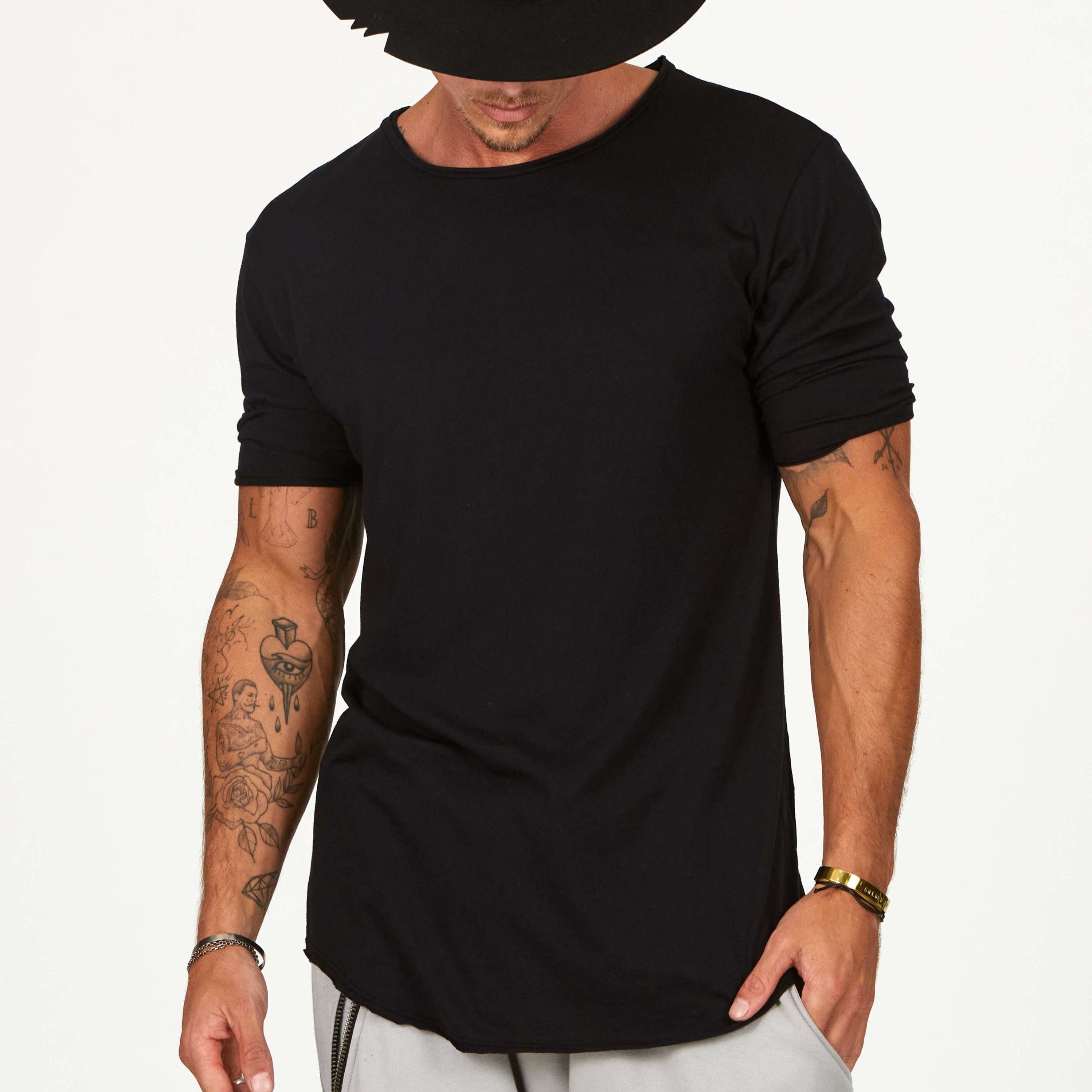 Male modeling black crew neck shirt