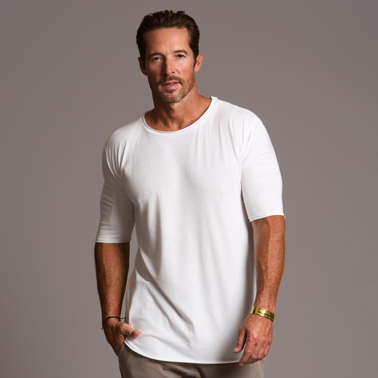 Male modeling white crew neck shirt