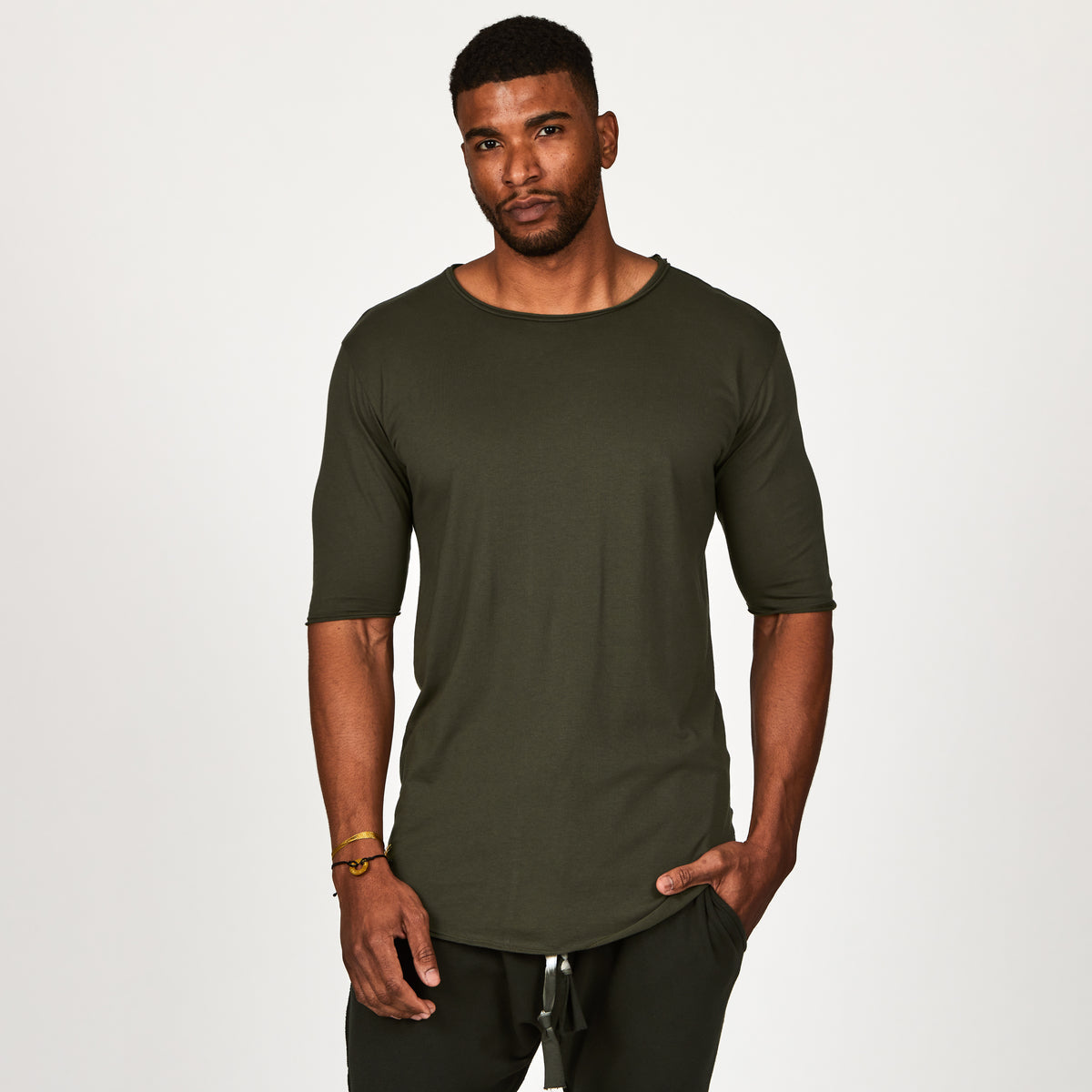 Male modeling green crew neck shirt