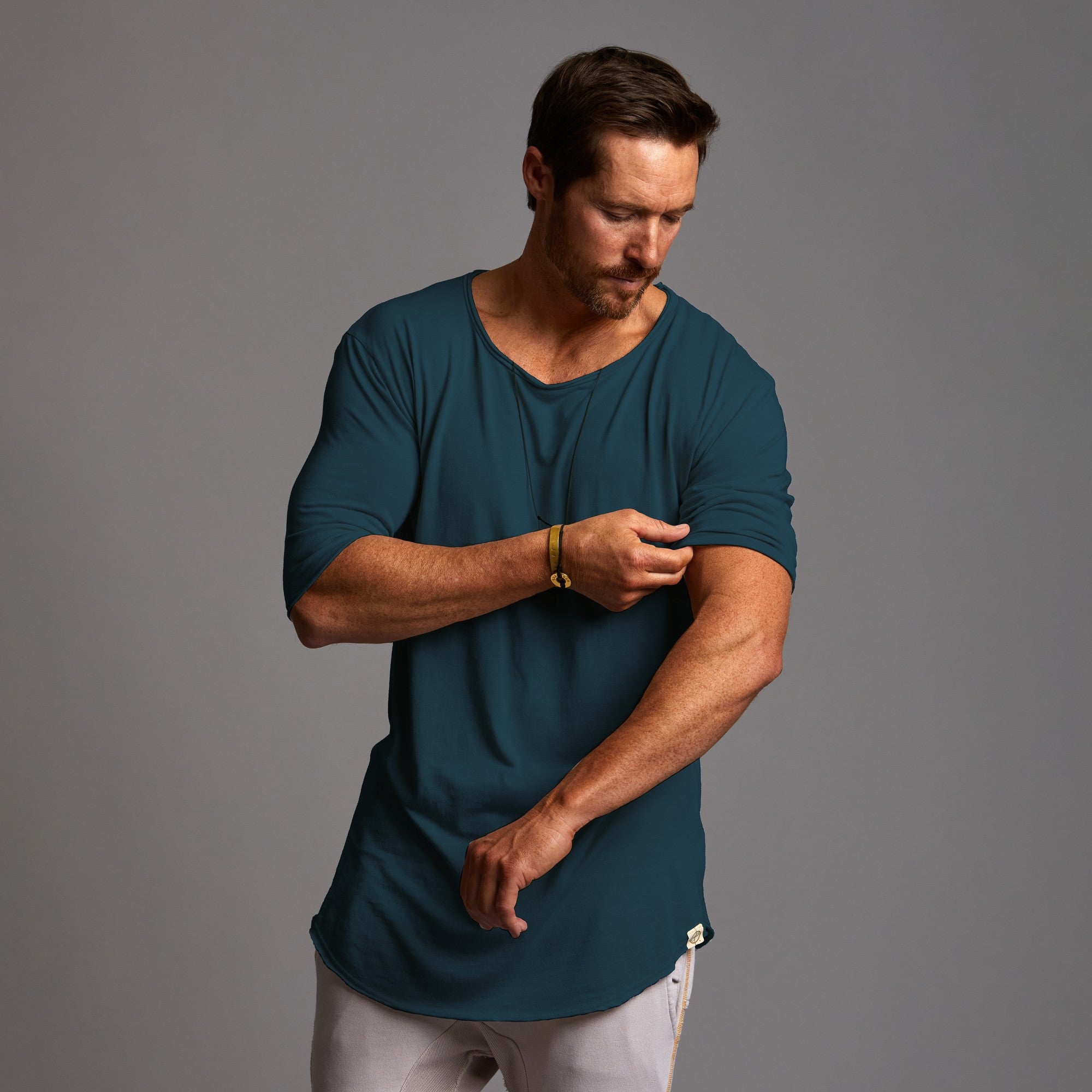 male modeling shirt in midnight teal
