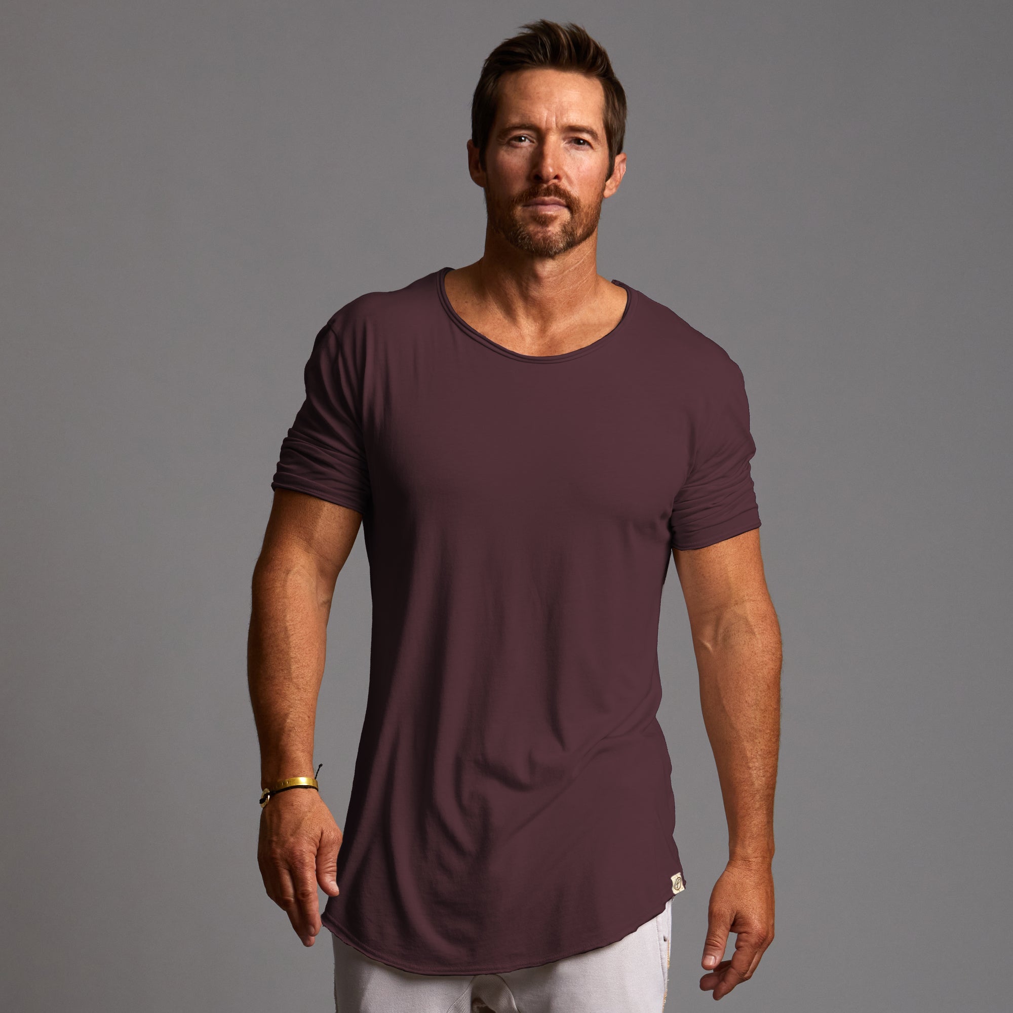 Male modeling crew tee in brazen